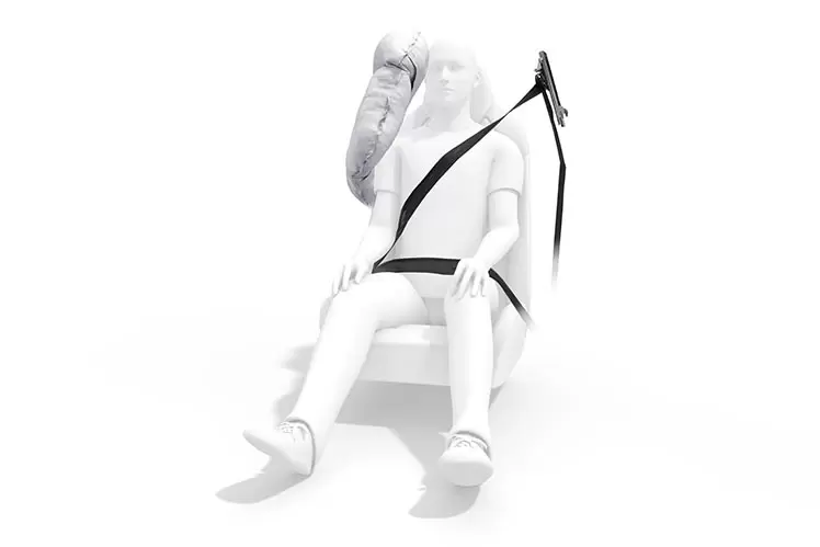 Person wearing seatbelt in car crash test