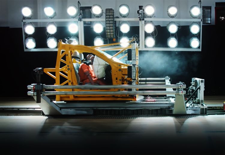 Car safety testing machine with crash test dummy